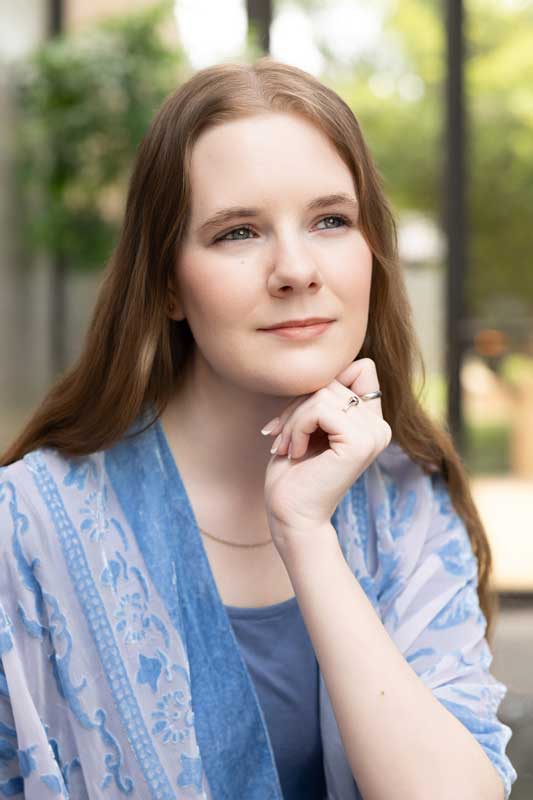 Dallas mental health professional with relaxed hands and serene expression